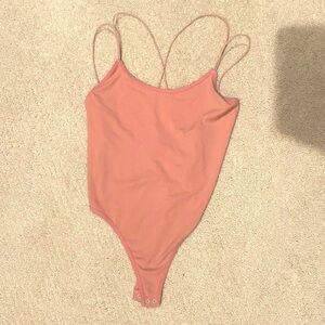 Free People Strappy Back Bodysuit
Never Worn !! - Size XS/S